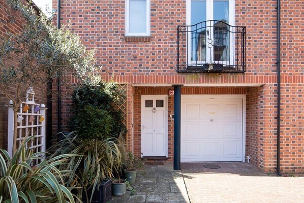 The front of this stylish 3 bedroom Chichester mews with garage