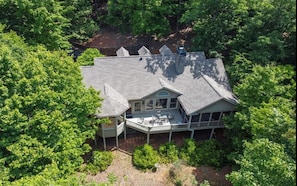 Overhead view of the house nestled in the trees
