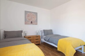 The twin bedroom features 2 super comfy single beds