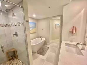 Master bedroom bathroom with shower and tub.