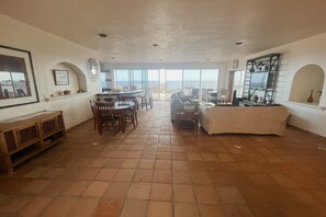 Main room and entry to kitchen and patio