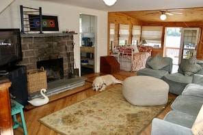 Living room with TV and plenty of comfortable seating
