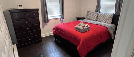 Queen-sized bed in First Bedroom 