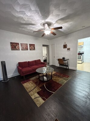 Living room with office work area.