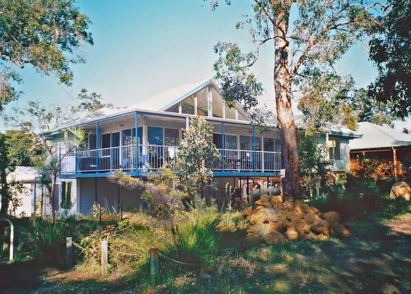 The capacious deck wraps around two sides of the house. Enjoy visits from the local bird life and critically endangered Western ringtail possums. A footpath runs past the rear of the property here, giving pedestrian access to town and the beach