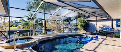 Fun patio area with pool and hot tub, both heated