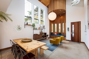 Open space, table, chairs, entrance door