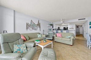 The ocean front living room is well-appointed with comfortable furnishings.