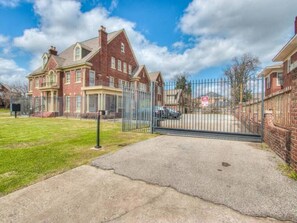 Here is a shot of the entrance, you have a private parking spot inside right in front of the second building where your apartment is located*Please note your apartment is in the historic brick building behind this large main front building*