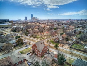 Nice Aerial view, Your property is located in the smaller historic carriage house right behind the main large red building. You can see the medical district a block away to the left and Downtown just a few minutes away by uber :)
