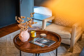 A warm welcome starts here—light a candle, flip through the guide to West Virginia’s hidden gems, and settle into a space that invites you to slow down, breathe deep, and feel instantly at home.