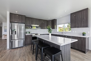 Prepare a meal in this spacious kitchen while looking out to the ocean. 