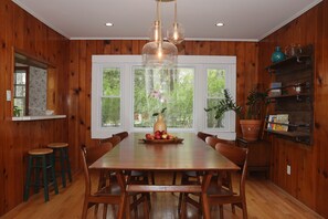 Spacious eating area for 6 people and high chair for a little one.