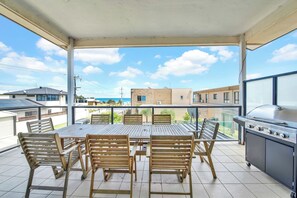 Dine al fresco with breathtaking views on our covered balcony