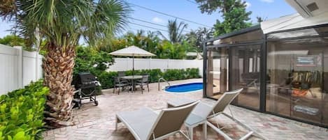 An outside lounge area overlooking the beautiful pool area. We are less than a mile walk to the Ocean, Restaurants and Bars.