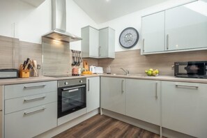 Ground floor: Kitchen with electric oven and hob, microwave, fridge/ freezer and dishwasher