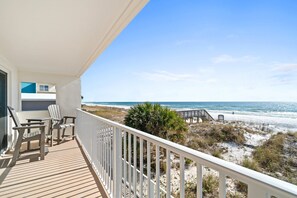 Enjoy the ocean breeze from your private balcony with seating for two