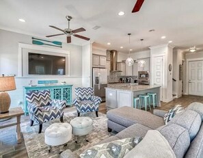 The interior is professionally designed with coastal decor. 