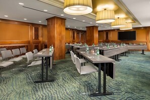 An equipped conference room, perfect place for a meeting!