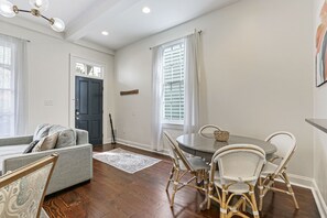 Dining table that seats four (with the option to add a leaf and two more chairs)