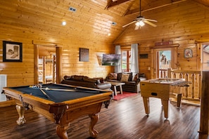 Game room with pool table and foosball.