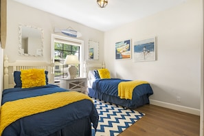 twin bedroom with two cozy twin-sized beds that comfortably sleep 2 people!
