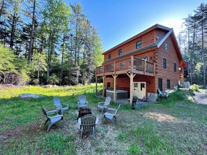 Back yard offers a fire pit and hot tub