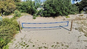 Volleyball Net - Soak up the sun and have competitive fun with the private volleyball court.