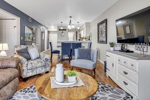 Open floor plan living room that flows into dining room and kitchen.