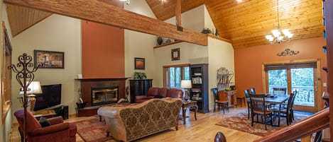 Grand living room with wood-burning fireplace