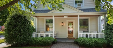 Charming front porch with chairs for coffee 