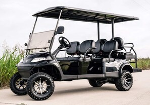 This custom 6 seater golf cart is yours to use while you stay.