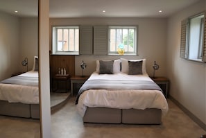 Luxurious bedroom with dressing table and Verdigris copper bath