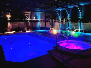 Pool, Hot Tub, and Splash Pad at Night