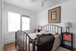 Queen sized bed with premium mattress and bed linens.