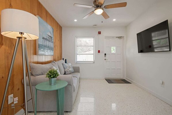 Cozy living room with sofa bed and Smart TV.