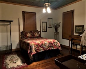 Front bedroom with queen bed and single day bed.  