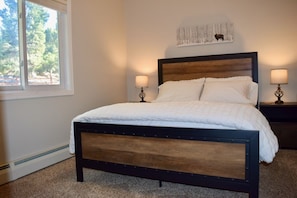 Upstairs bedroom with queen bed.
