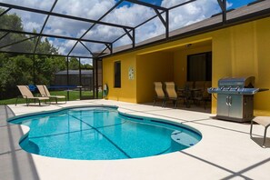 Spacious pool deck with covered outdoor dining