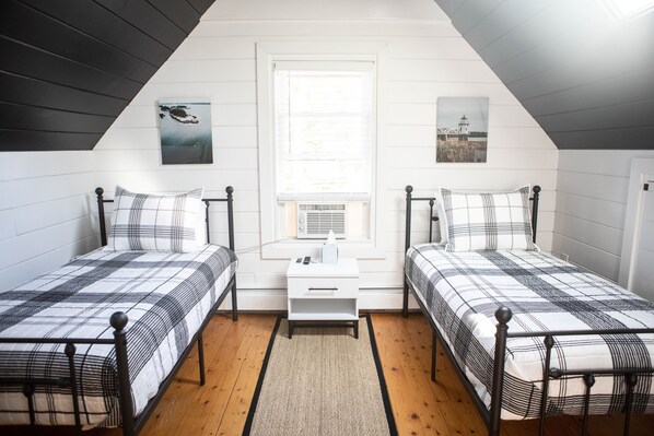 Attic bedroom with two twin beds. Newly renovated.