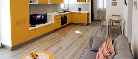 Furniture, Property, Cabinetry, Table, Countertop, Wood, Orange, Couch, Yellow, Lighting