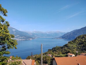 Water, Sky, Mountain, Water Resources, Azure, Highland, Tree, Lake, Cloud, Coastal And Oceanic Landforms