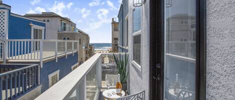 Step out of the bunkroom onto the balcony to check the waves every morning