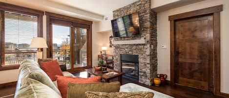 Comfortable living room with gas fireplace and large screen TV