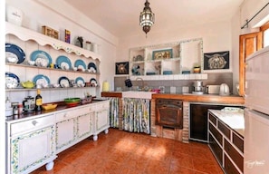 Kitchen has been hand built by the owner, a painter and furniture restorer 