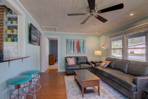 Plenty of comfortable seating in the living room, which adjoins the kitchen.