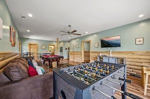 Game room with foosball, pool table and comfortable seating!