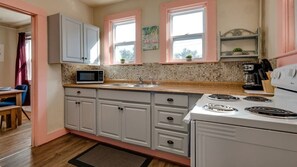 Cute updated kitchen stocked with the basics to help you feel "at home."