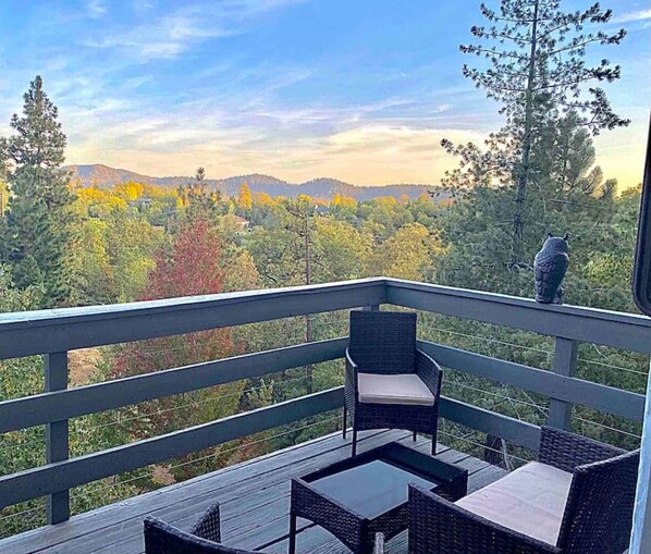 Morning coffee with a view 🍃☕️ Surrounded by trees, peace, and golden mountain light — nature at its finest.