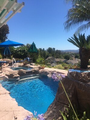 View of pool in foreground, with an endless view of Saddleback Valley.